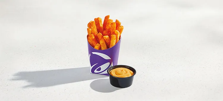 Nacho Fries: Golden, crisp Nacho Fries seasoned with bold Mexican spices and nacho cheese sauce for dipping.