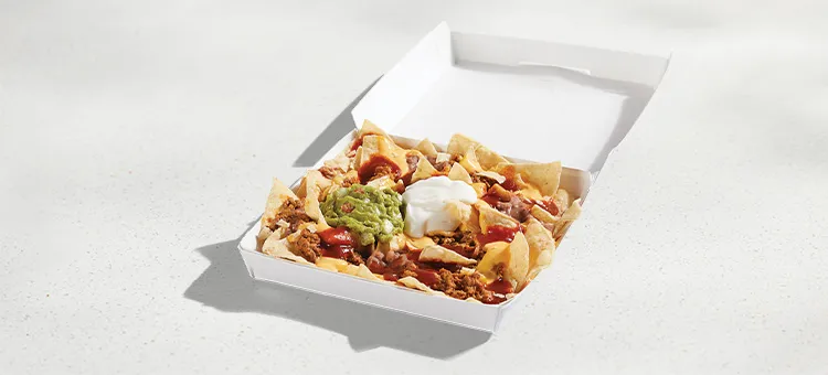 Loaded Beef Nachos: Warm-and-crispy tortilla chips with seasoned beef, refried beans, warm Nacho Cheese sauce, Red Sauce…