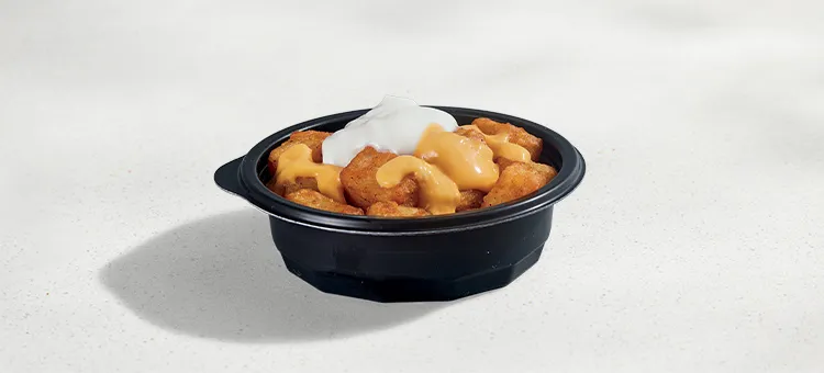 Cheesy Fiesta Potatoes: Seasoned potatoes topped with warm Nacho Cheese sauce and Reduced-fat sour cream.