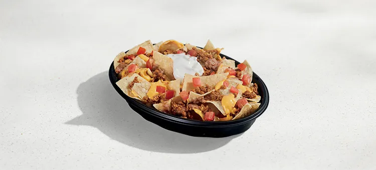 Nachos BellGrande®: Warm-and-crispy tortilla chips with seasoned beef, refried beans, diced tomatoes, warm Nacho Cheese…