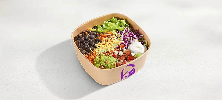Veggie Bowl: A bowl filled with seasoned rice, black beans, lettuce, shredded purple cabbage, freshly prepared pico de…