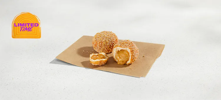 Dulce de Leche Cinnabon Delights® 2pk: Warm donut holes filled with Dulce de Leche filling and dusted in salted caramel…