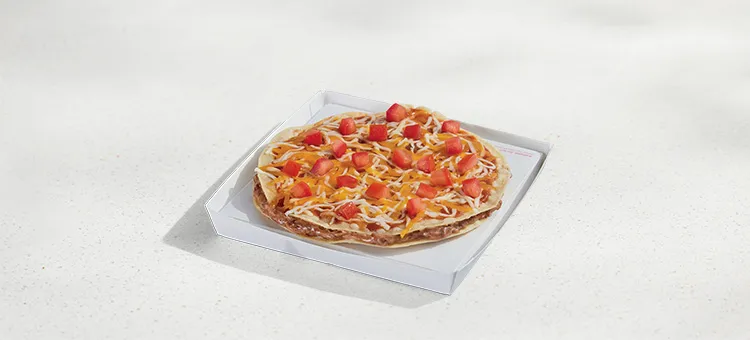 Veggie Mexican Pizza: Refried Beans layered between two crispy, flour tortilla shells with Mexican Pizza sauce, diced…