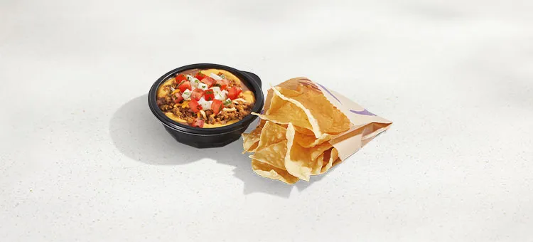 Chips and Nacho Supreme Dip: Layers of seasoned beef, beans, Nacho cheese sauce, reduced-fat sour cream, pico de gallo, and…