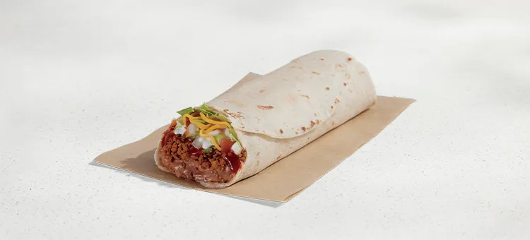 Burrito Supreme®: A warm flour tortilla filled with seasoned beef, refried beans, diced tomatoes & onions, lettuce, Red…