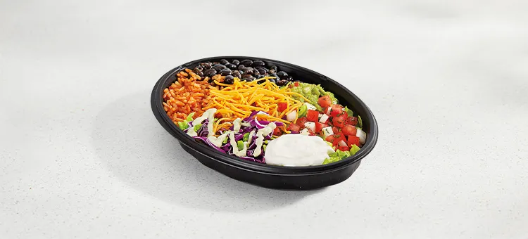 Veggie Bowl: A bowl filled with seasoned rice, black beans, lettuce, shredded purple cabbage, freshly prepared pico de…