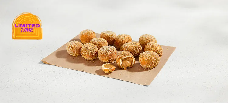 Dulce de Leche Cinnabon Delights® 12pk: Warm donut holes filled with Dulce de Leche filling and dusted in salted caramel…