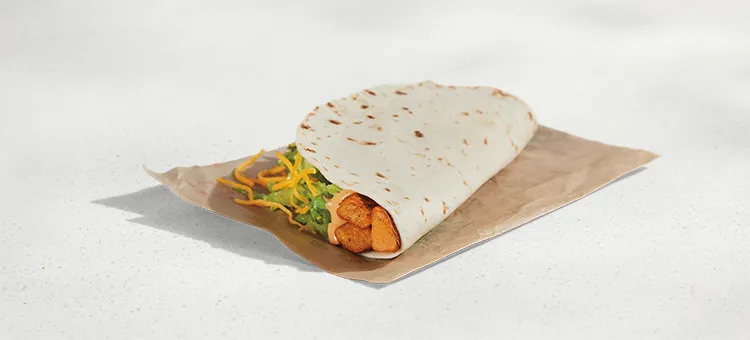 Spicy Potato Soft Taco: A warm flour tortilla filled with seasoned potatoes, Creamy Chipotle sauce, lettuce, and shredded…