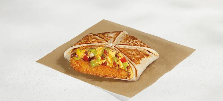 Breakfast California Crunchwrap: A warm flour tortilla filled with a hash brown, fluffy cage-free eggs, flavorful bacon…
