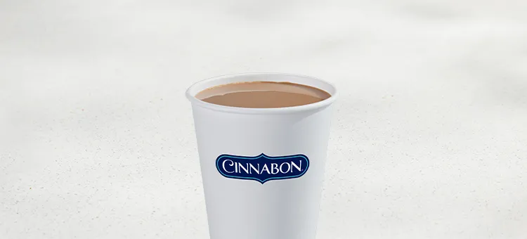 Hot Cinnabon Delights® Coffee: Premium roast coffee with vanilla creamer and Cinnabon Delights® flavor served hot.
