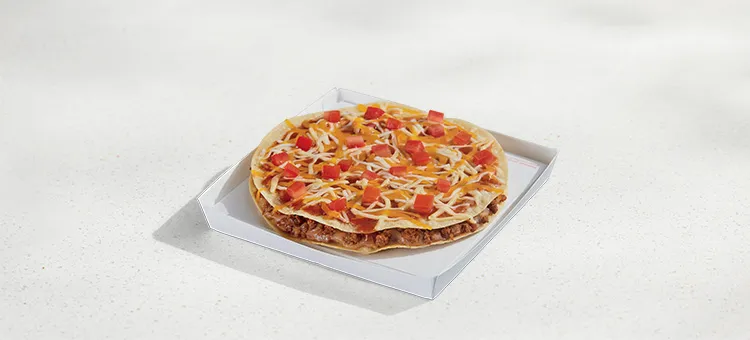 Mexican Pizza: Seasoned beef and refried beans layered between two crispy, flour tortilla shells with Mexican Pizza sauce…
