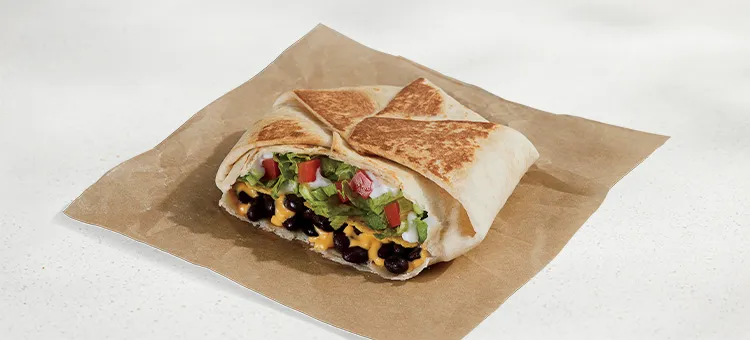 Black Bean Crunchwrap Supreme®: A warm flour tortilla filled with slow-simmered black beans, warm Nacho Cheese sauce, a…