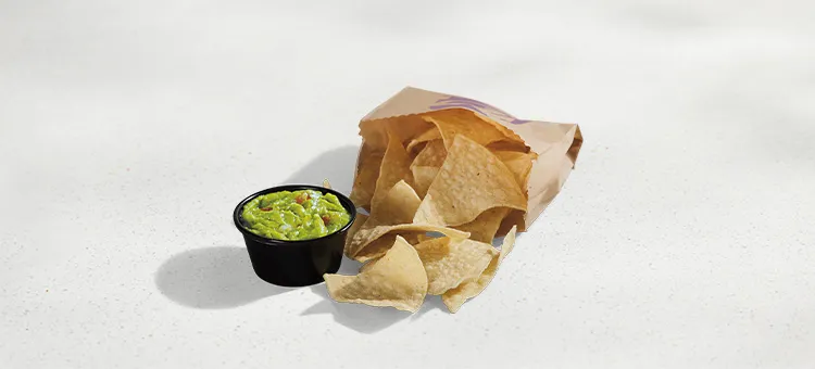 Chips and Guacamole: Warm-and-crispy tortilla chips with a side of guacamole made with Hass avocados to dip.